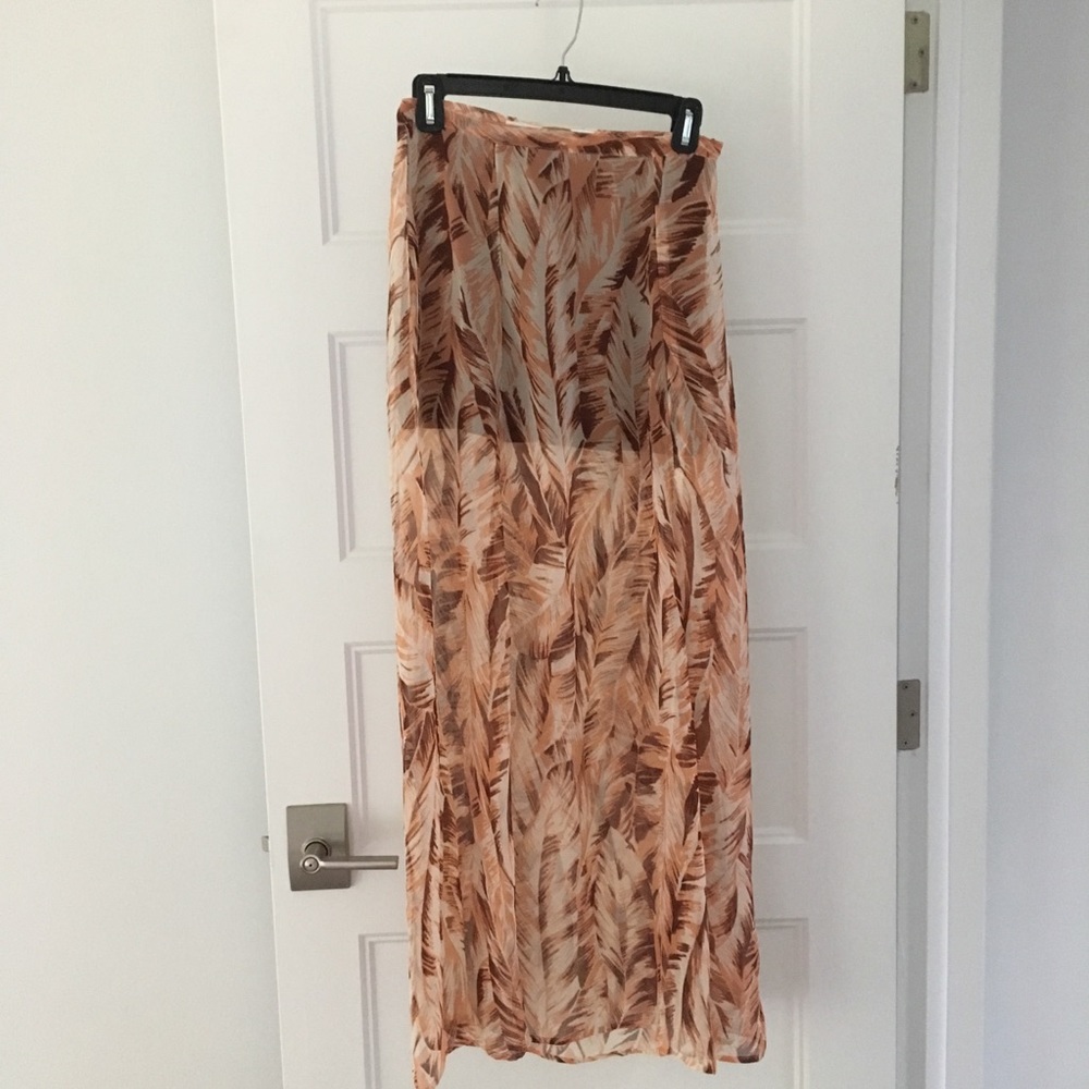 Beautiful print maxi skirt with front slits.